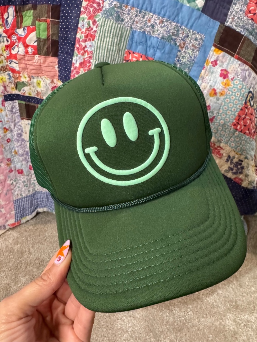 green smiley face trucker hat